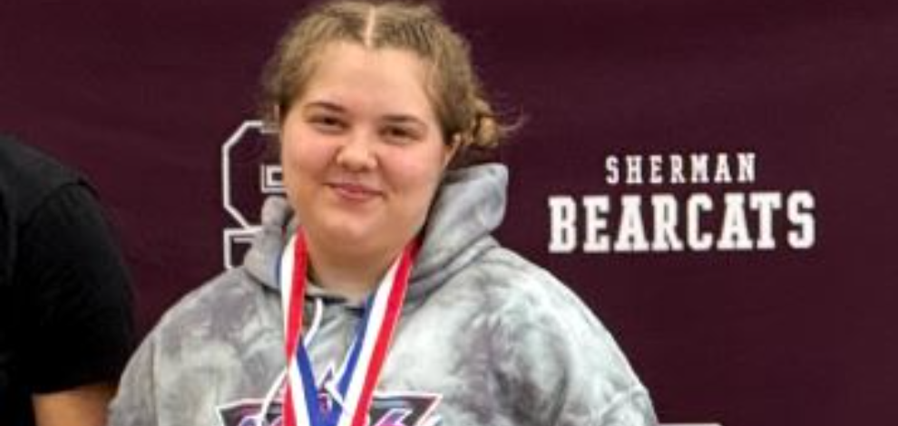 Elena Moreno showing off her Regional 2nd place medal